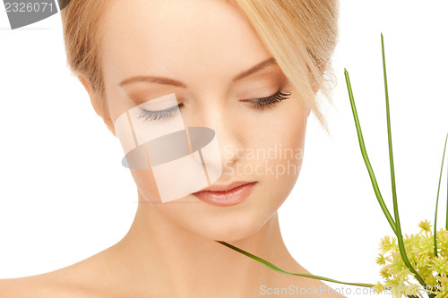Image of woman with green sprout
