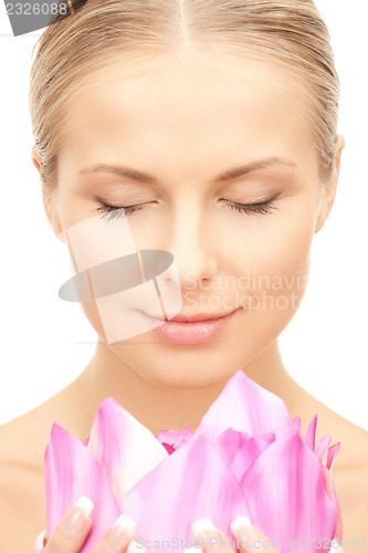 Image of beautiful woman with lotus flower