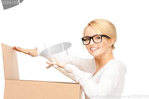 Image of attractive businesswoman with cardboard box