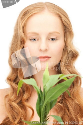 Image of woman with green sprout