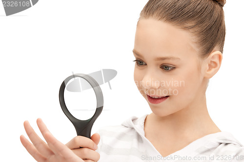 Image of teenage girl with magnifying glass