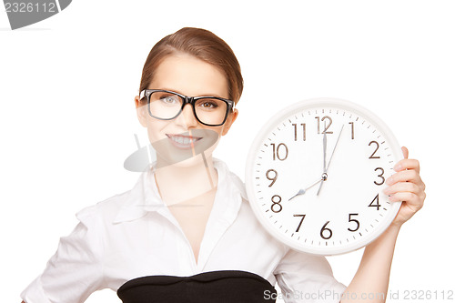 Image of woman holding big clock