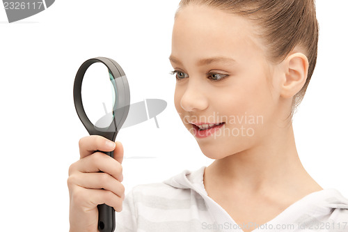 Image of teenage girl with magnifying glass