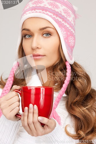 Image of woman with red mug