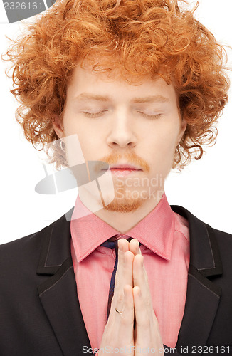 Image of praying businessman