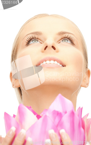 Image of beautiful woman with lotus flower