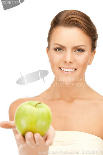 Image of young beautiful woman with green apple
