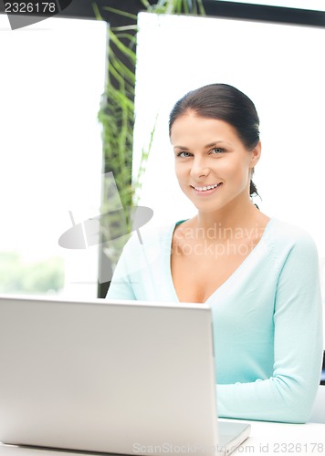 Image of happy woman with laptop computer