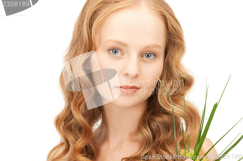 Image of woman with green sprout