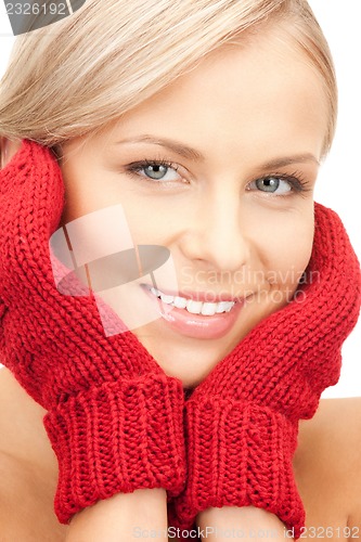 Image of beautiful woman in mittens