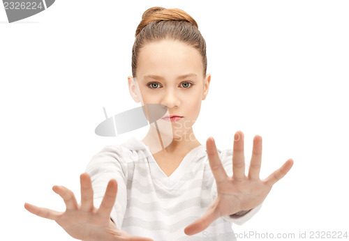 Image of teenage girl making stop gesture