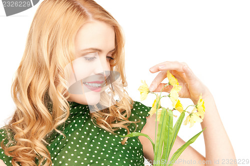 Image of lovely housewife with flower