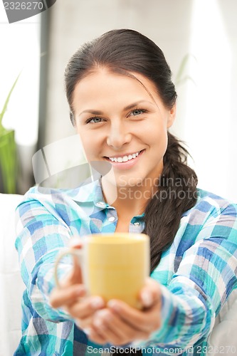 Image of lovely housewife with mug