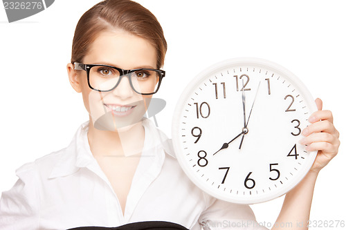 Image of woman holding big clock