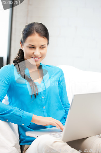 Image of happy woman with laptop computer