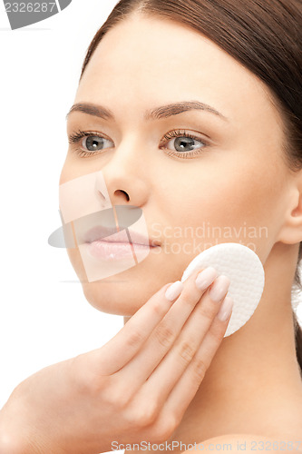 Image of beautiful woman with cotton pad