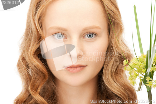 Image of woman with green sprout