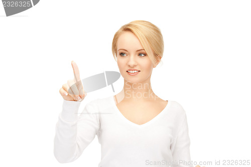 Image of businesswoman working with something imaginary