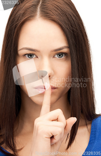 Image of finger on lips