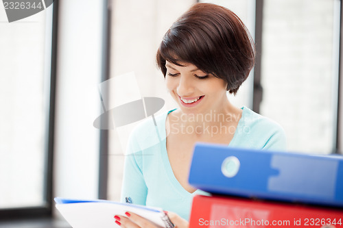 Image of woman with folders