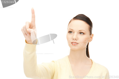 Image of businesswoman working with something imaginary