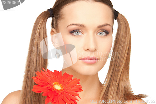 Image of lovely woman with red flower