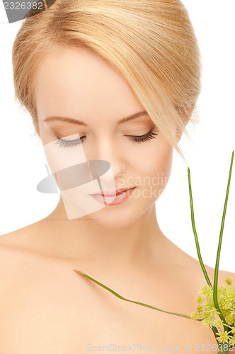 Image of woman with green sprout