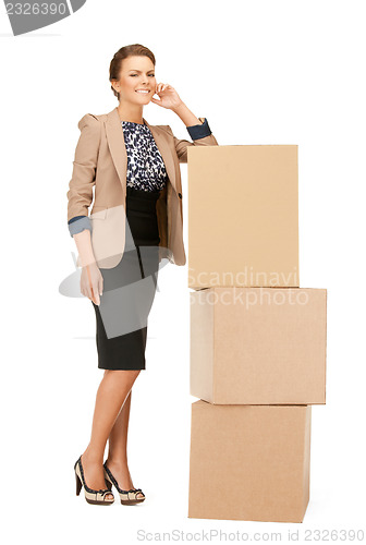 Image of attractive businesswoman with big boxes