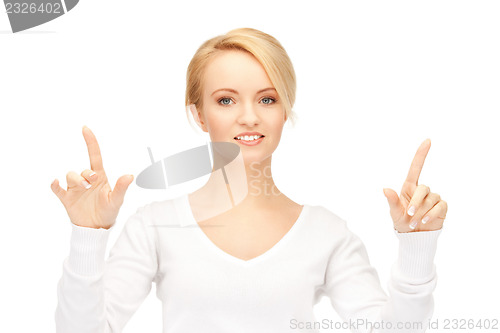 Image of businesswoman working with something imaginary