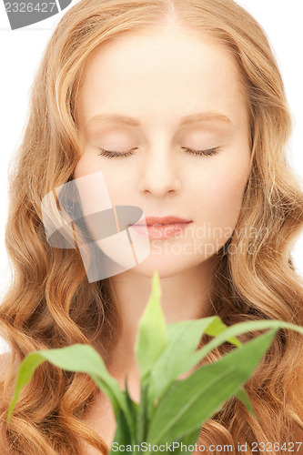 Image of woman with green sprout