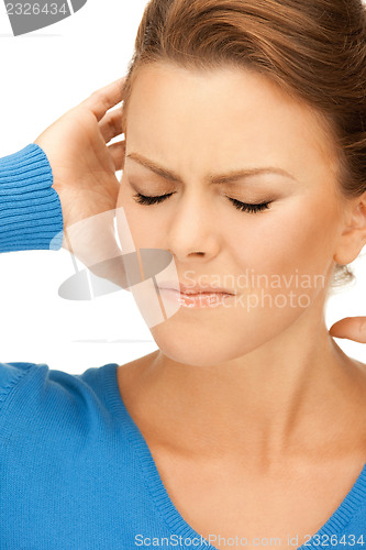 Image of woman with hands on ears