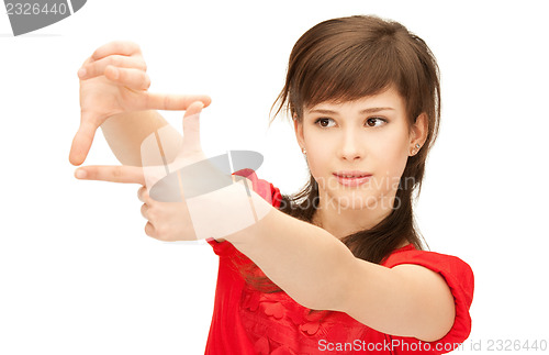 Image of teenage girl creating a frame with fingers