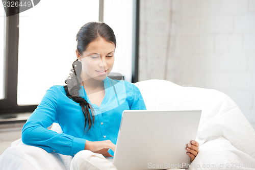 Image of happy woman with laptop computer