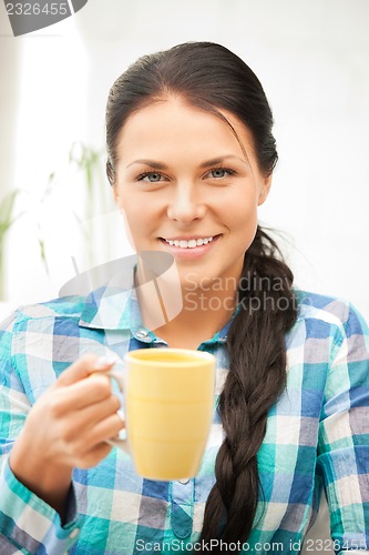 Image of lovely housewife with mug