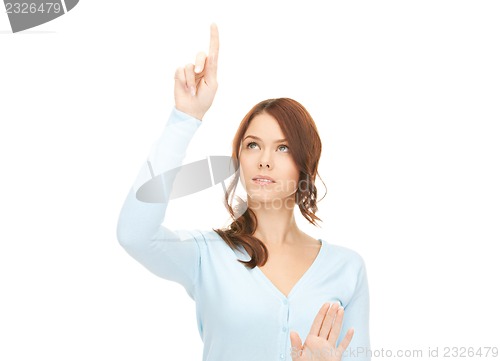 Image of businesswoman working with something imaginary