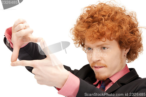 Image of handsome man creating a frame with fingers