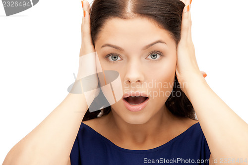 Image of woman with hands on ears