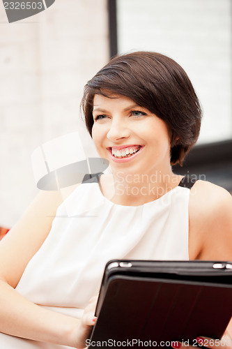 Image of happy woman with tablet pc computer