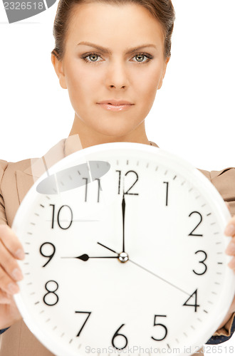 Image of woman holding big clock