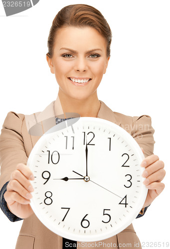 Image of woman holding big clock