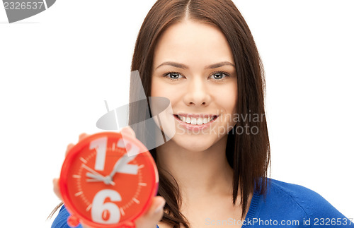 Image of woman holding alarm clock