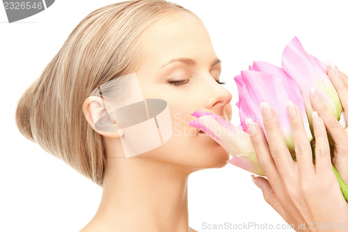 Image of beautiful woman with lotus flower