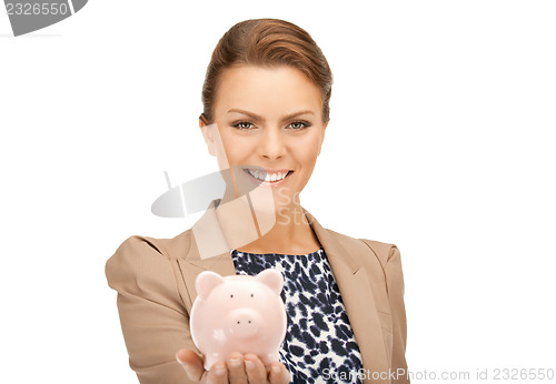 Image of lovely woman with piggy bank