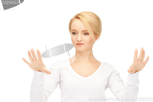 Image of businesswoman working with something imaginary