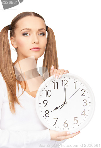 Image of woman holding big clock