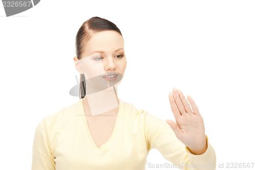Image of businesswoman working with something imaginary