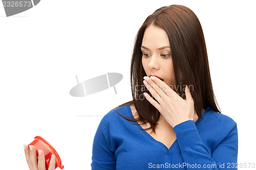 Image of woman holding alarm clock