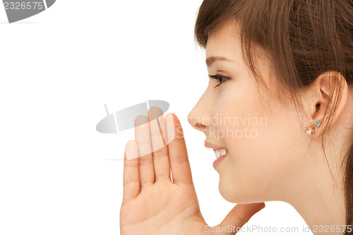 Image of teenage girl whispering gossip