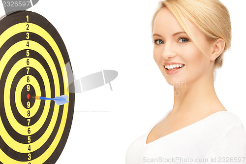 Image of businesswoman with dart and target