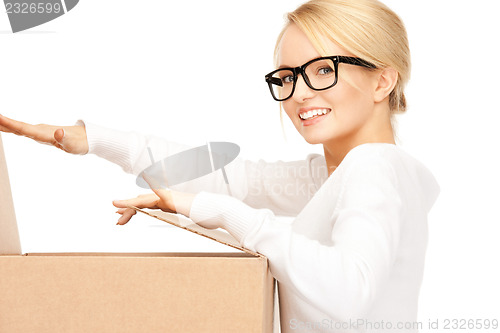 Image of attractive businesswoman with cardboard box